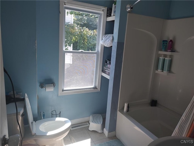 bathroom featuring toilet, tile patterned flooring, visible vents, and baseboards