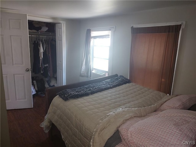 bedroom with a closet and wood finished floors