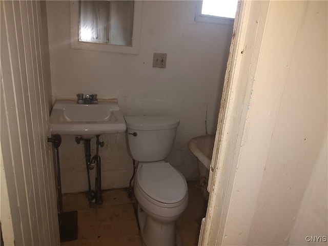 bathroom featuring toilet and a sink