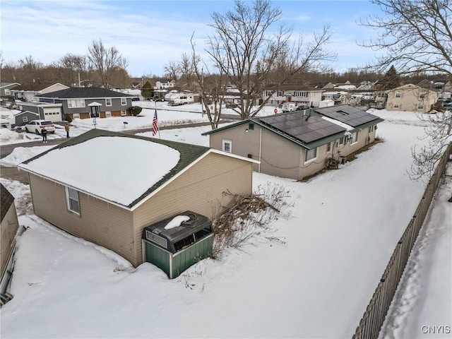 snowy aerial view with a residential view