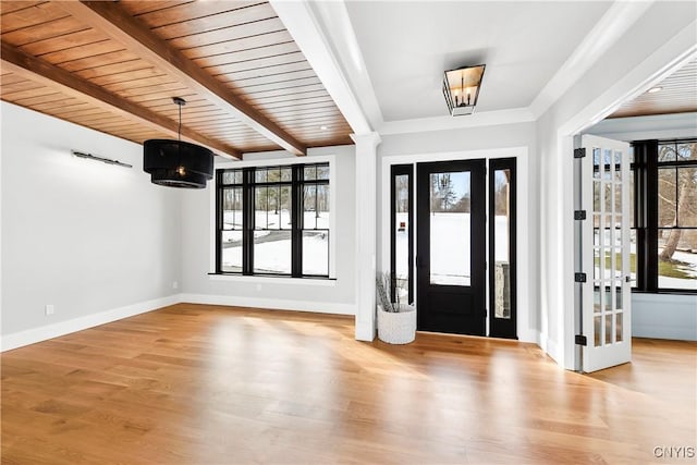 entryway featuring decorative columns, wood ceiling, wood finished floors, beamed ceiling, and baseboards