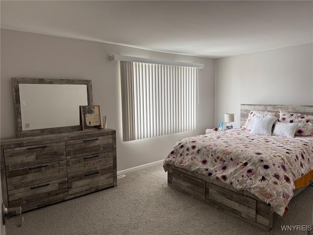 carpeted bedroom with baseboards