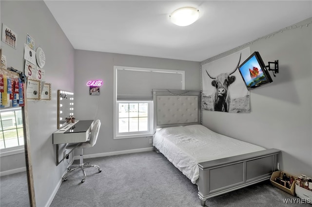 carpeted bedroom with baseboards