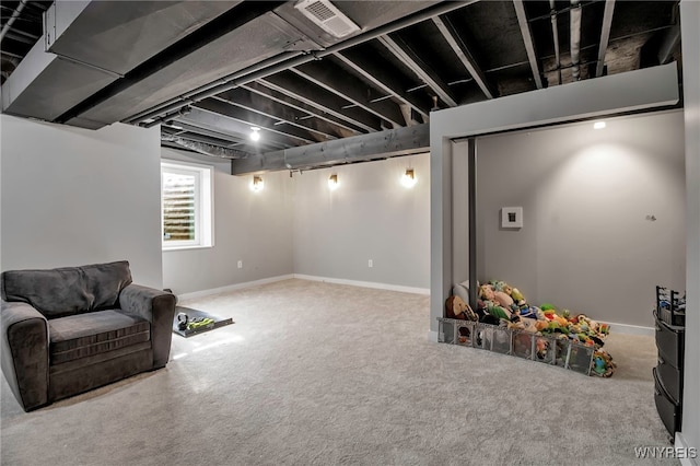 below grade area with carpet and baseboards