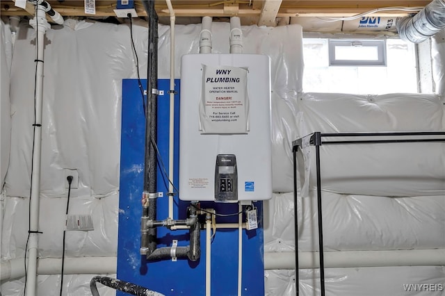 utility room with tankless water heater