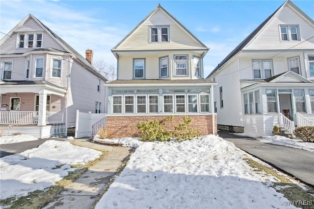 view of front of home with a sunroom