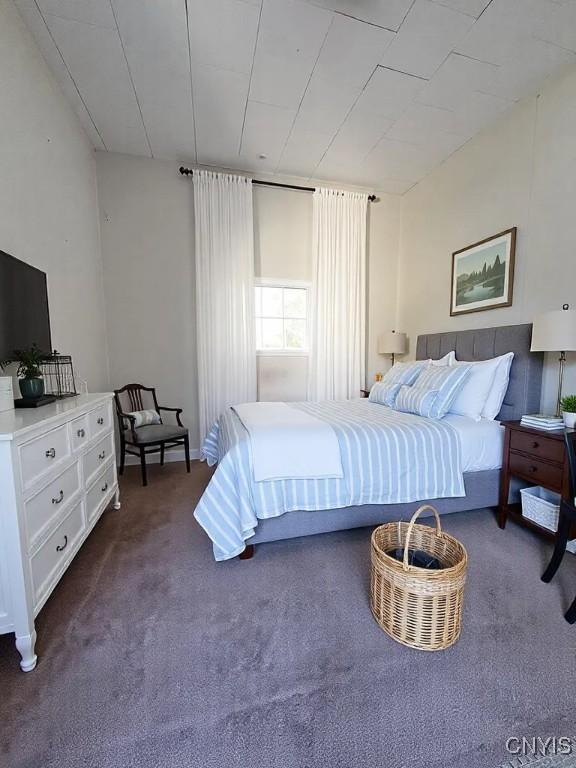 bedroom with dark carpet
