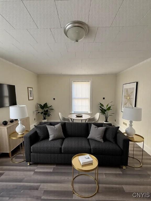 living area with wood finished floors and baseboards