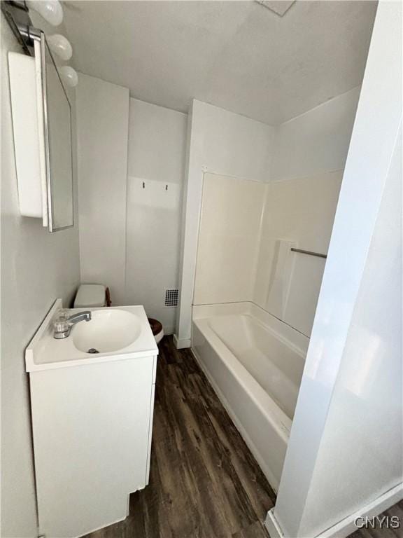 full bath featuring vanity and wood finished floors