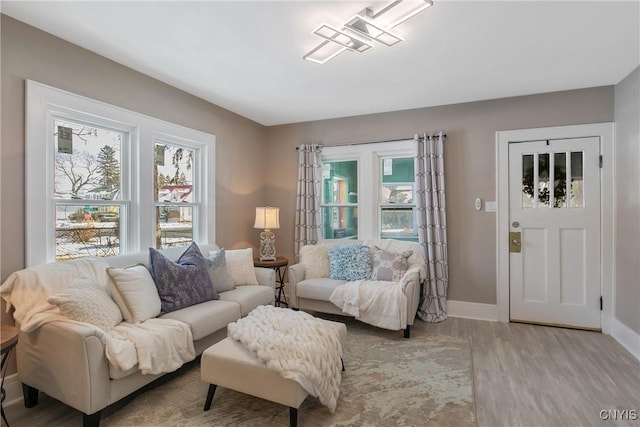 living room featuring wood finished floors and baseboards