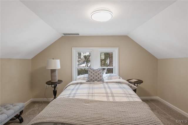 bedroom featuring carpet floors, baseboards, visible vents, and vaulted ceiling