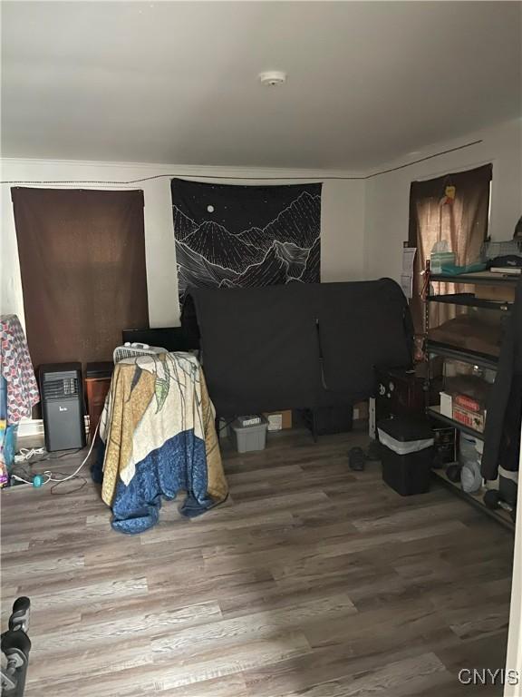 bedroom with wood finished floors