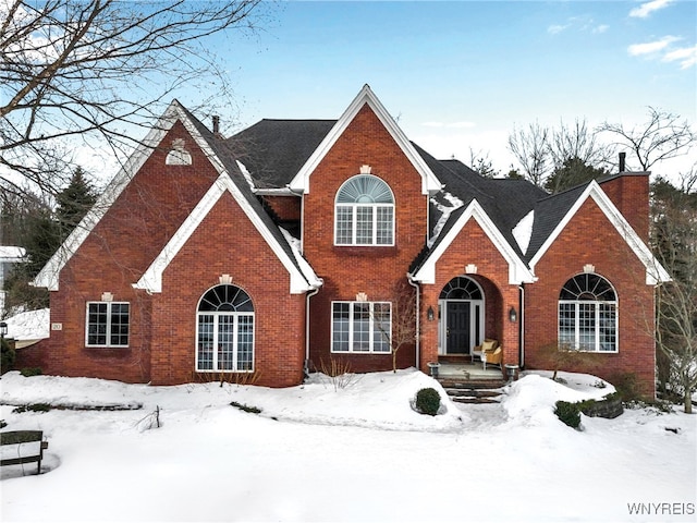 traditional-style home featuring brick siding