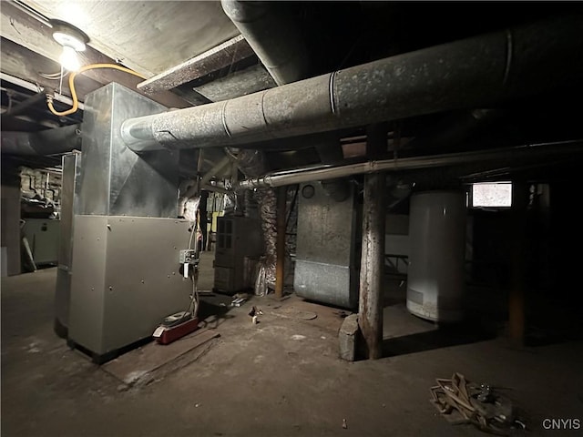 unfinished basement with heating unit and gas water heater