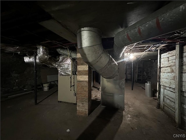 unfinished basement with heating unit