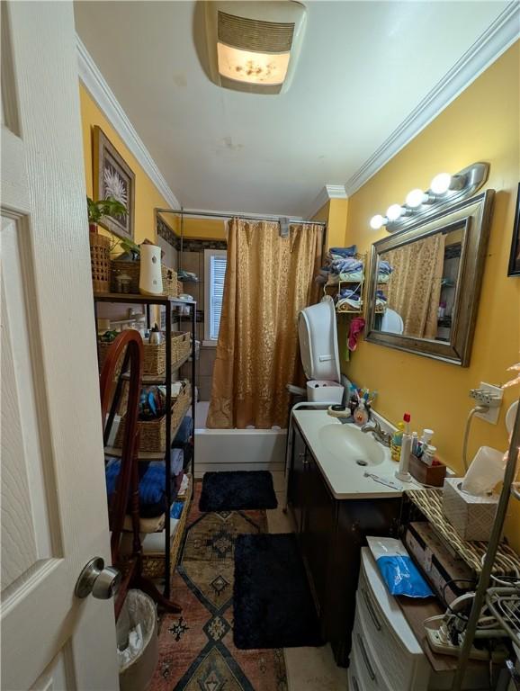 interior space featuring ornamental molding, a sink, and tile patterned floors