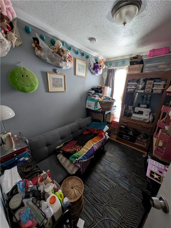 carpeted bedroom featuring a textured ceiling