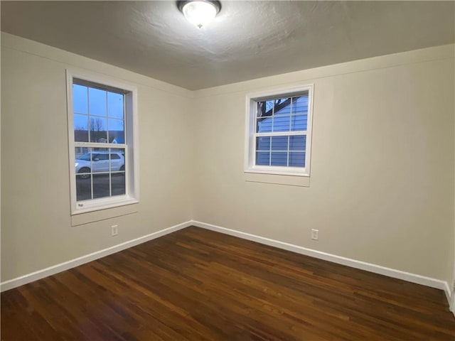 4027 Rockwell Ave, Horseheads, NY 14845 - empty room featuring baseboards and dark wood-type flooring