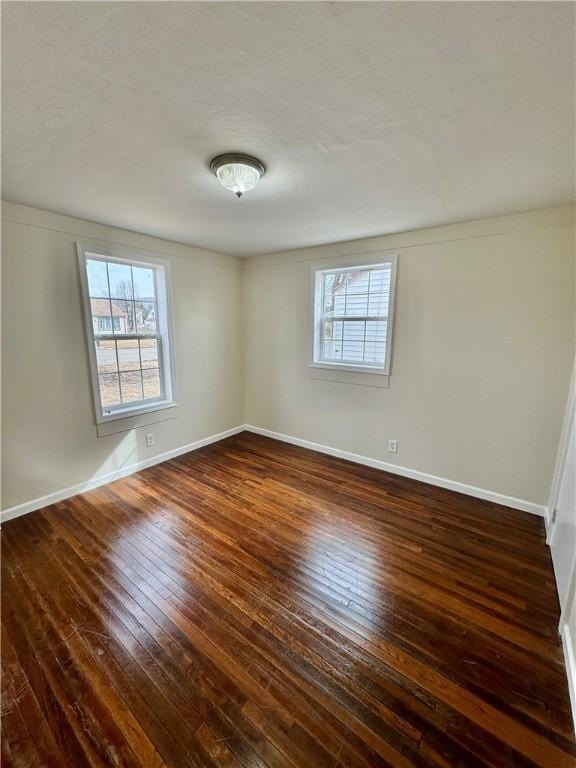 4027 Rockwell Ave, Horseheads, NY 14845 - spare room with dark wood-style floors and baseboards