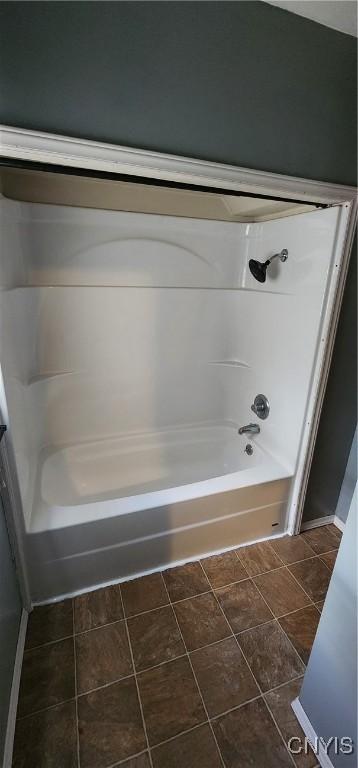 bathroom with tile patterned floors