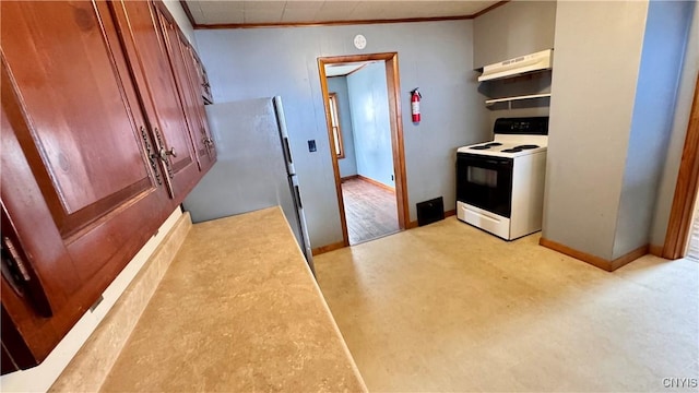 kitchen with range with electric stovetop, ornamental molding, freestanding refrigerator, under cabinet range hood, and baseboards