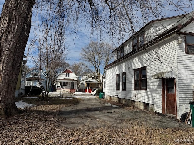 view of side of home with a residential view