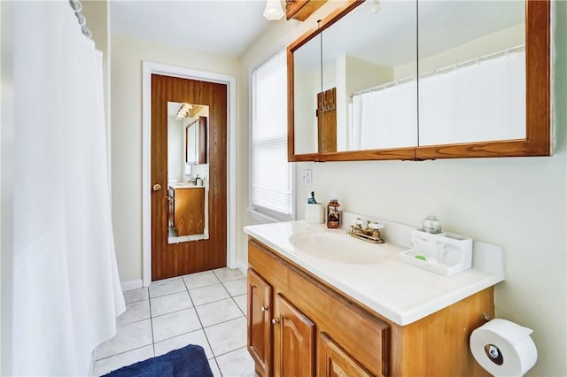 full bathroom featuring tile patterned flooring and vanity