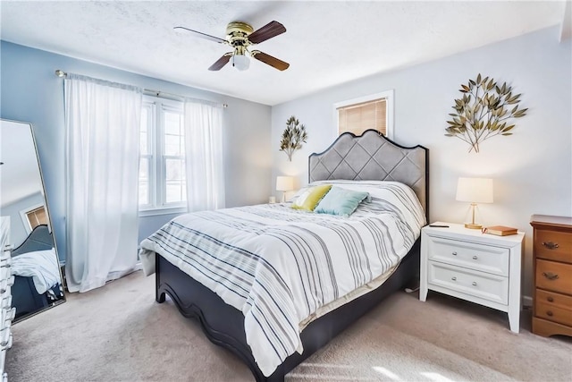 carpeted bedroom featuring a ceiling fan