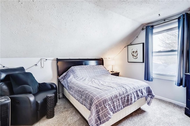 carpeted bedroom featuring lofted ceiling, a textured ceiling, and baseboards