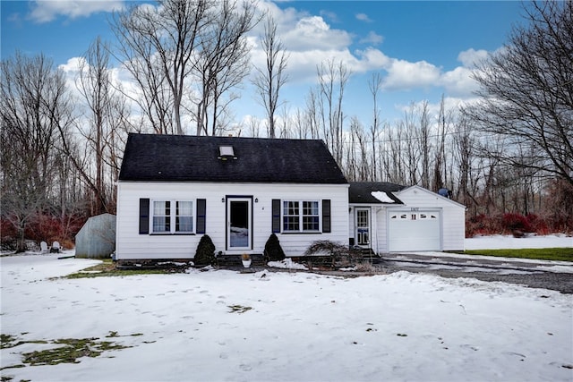 cape cod-style house with an attached garage