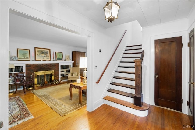 interior space featuring a fireplace and wood finished floors