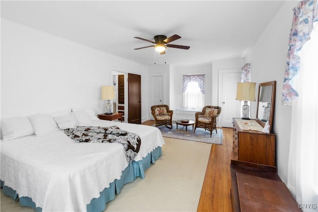 bedroom with ceiling fan and wood finished floors