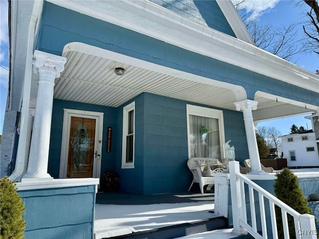 property entrance featuring covered porch