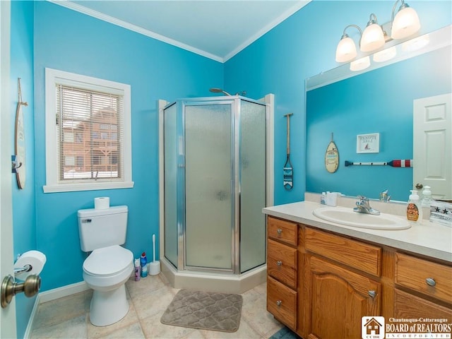 bathroom with ornamental molding, toilet, a shower stall, and vanity