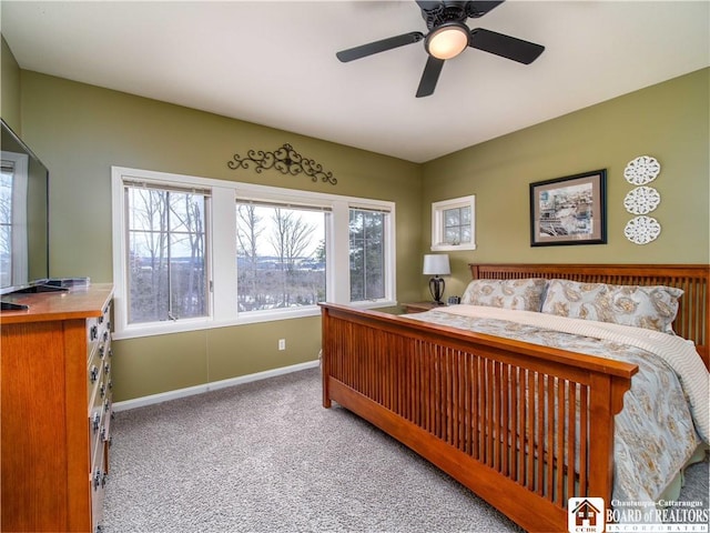 carpeted bedroom featuring a ceiling fan and baseboards