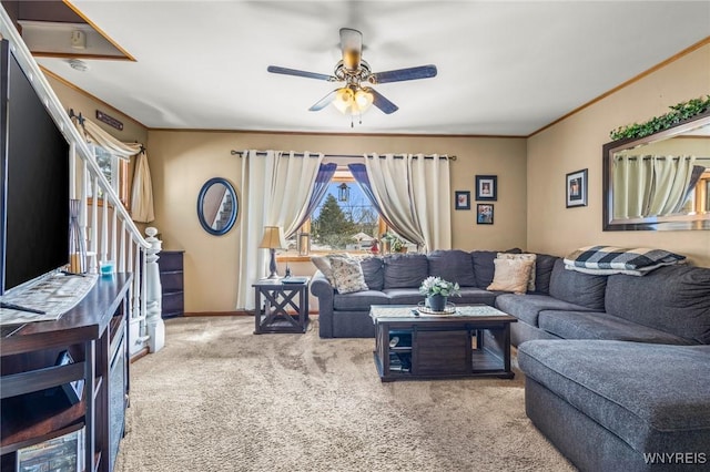 living room featuring carpet, plenty of natural light, ceiling fan, and crown molding