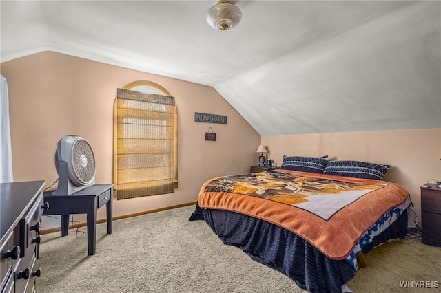 bedroom with lofted ceiling, baseboards, and carpet flooring