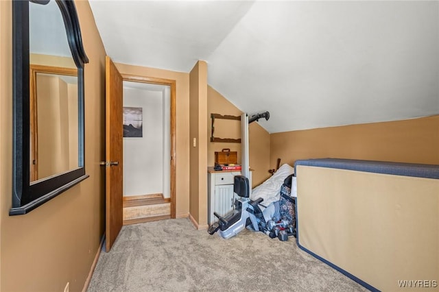 bonus room with lofted ceiling, carpet flooring, and baseboards