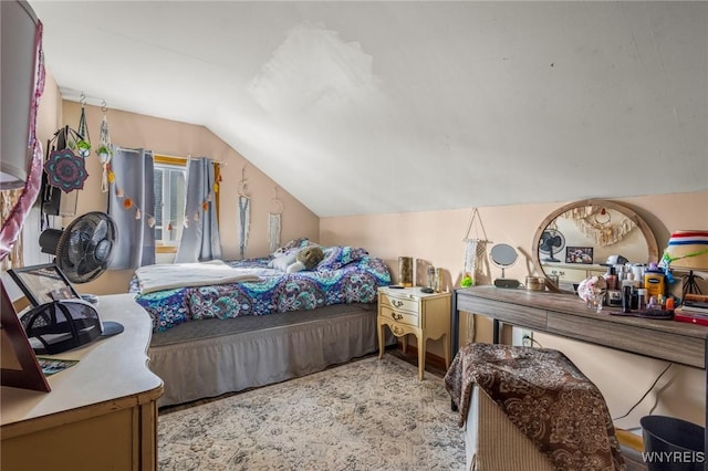 bedroom featuring lofted ceiling