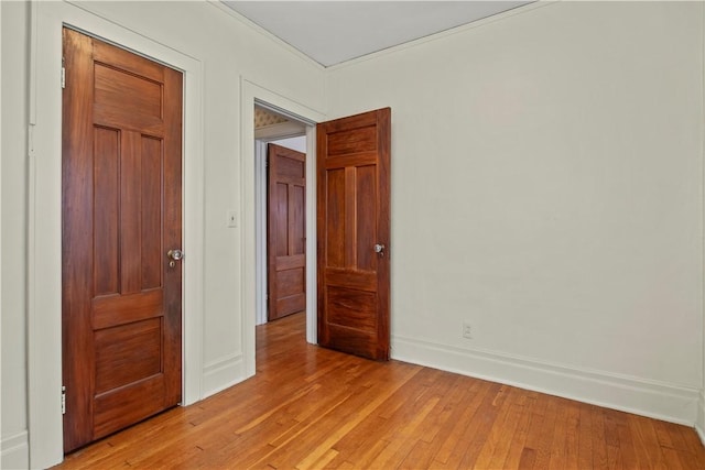 unfurnished bedroom featuring baseboards and light wood finished floors