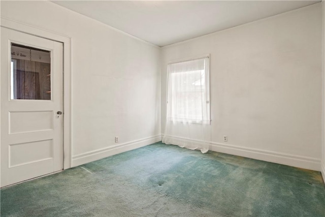 carpeted spare room with baseboards