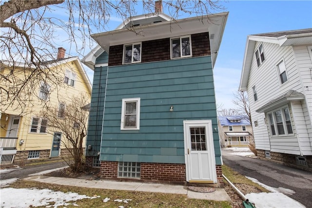 rear view of house with driveway