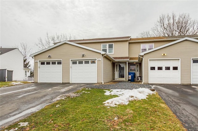 view of front of home featuring aphalt driveway and an attached garage