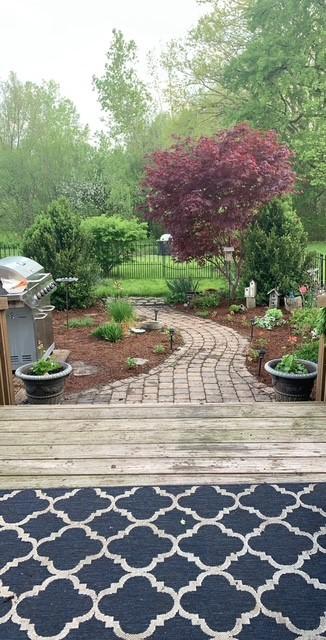 exterior space featuring a deck and fence