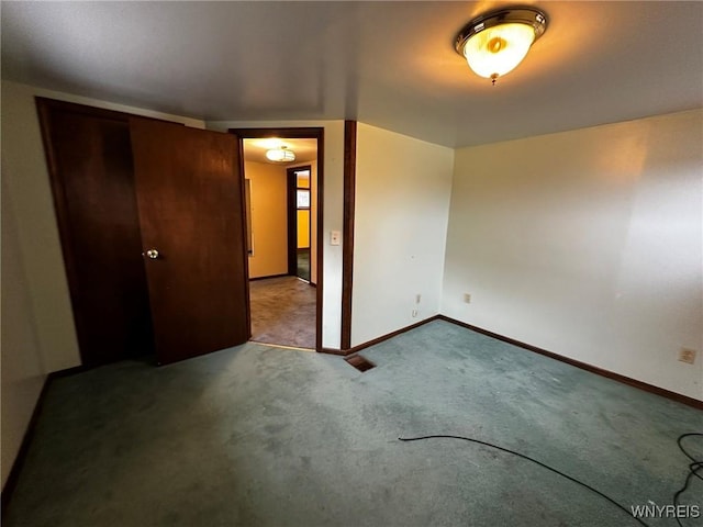 interior space with carpet floors and baseboards