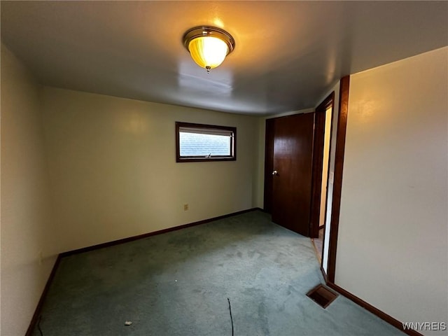 unfurnished bedroom featuring carpet, visible vents, and baseboards