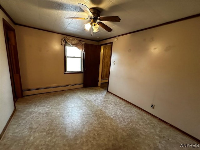 empty room with baseboards, baseboard heating, and crown molding