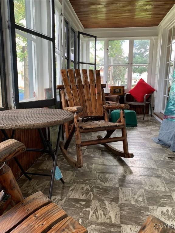 sunroom / solarium featuring wooden ceiling