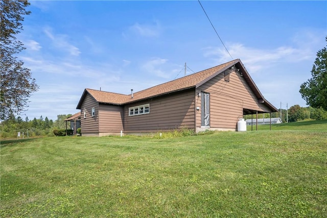 view of home's exterior featuring a yard