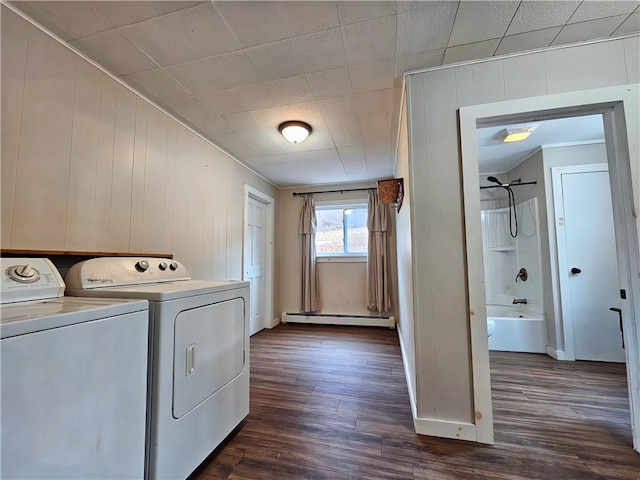 washroom with dark wood-style floors, laundry area, a baseboard radiator, and washing machine and clothes dryer